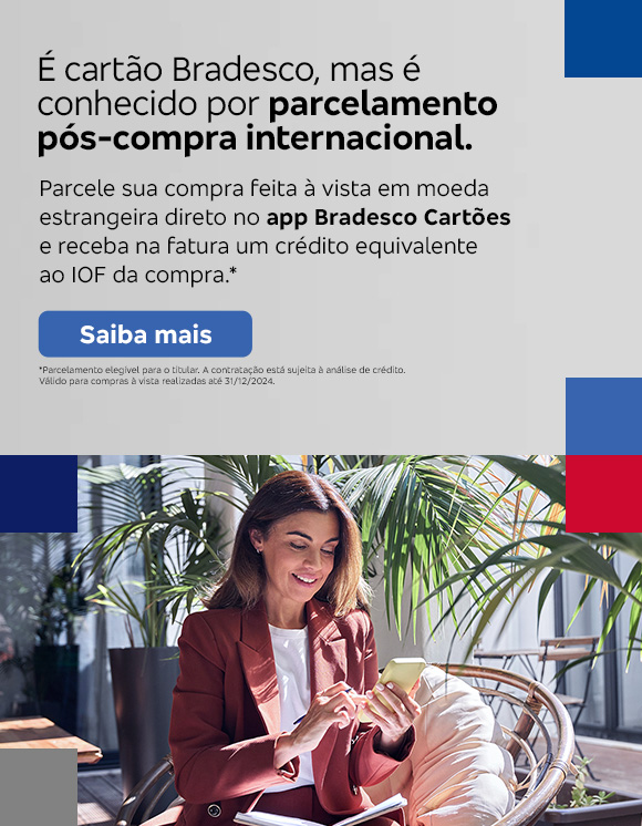 #BradescoAcessível #PraTodoMundoVer:Texto: É cartão Bradesco, mas é conhecido por parcelamento pós-compra internacional. Parcele sua compra feita à vista em moeda estrangeira direto no app Bradesco Cartões e receba na fatura um crédito equivalente ao IOF da compra.* Botão: Saiba mais. Texto legal: *Parcelamento elegível para o titular. A contratação está sujeita à análise de crédito. Válido para contratações até 30/06/2025.“ Saiba mais
           Descrição da imagem: A peça publicitária é divida em duas partes. À direita, vemos a foto de uma mulher sorridente, segurando e olhando para um smartphone. Ela está vestindo uma um blazer bordô e uma camisa branca. À esquerda da peça, vemos um fundo cinza, com elementos gráficos nas bordas e o texto, seguido do botão e texto legal, sobreposto. 